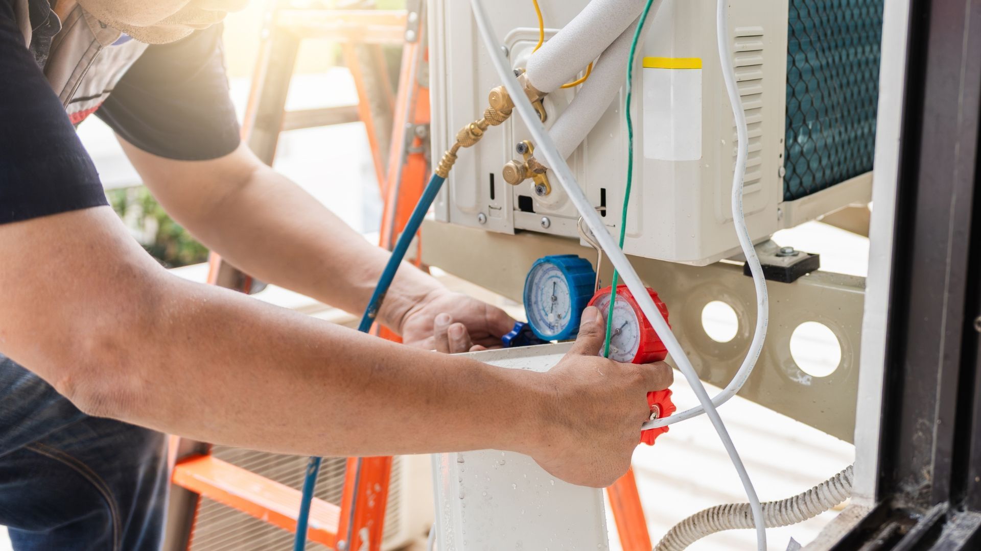 Technician using a tool to service wiring inside an electrical panel
