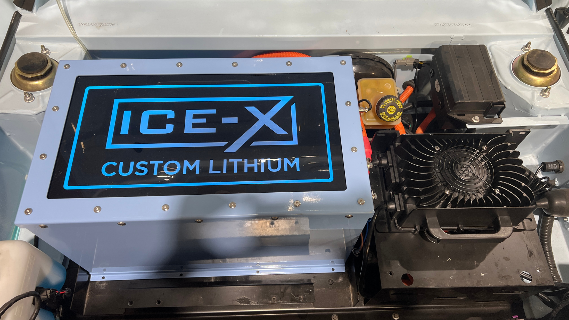 A light blue battery box labeled