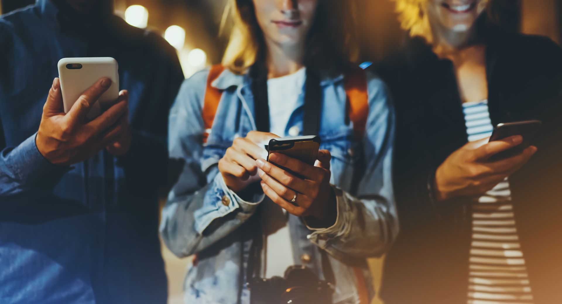 People using mobile device to access a website