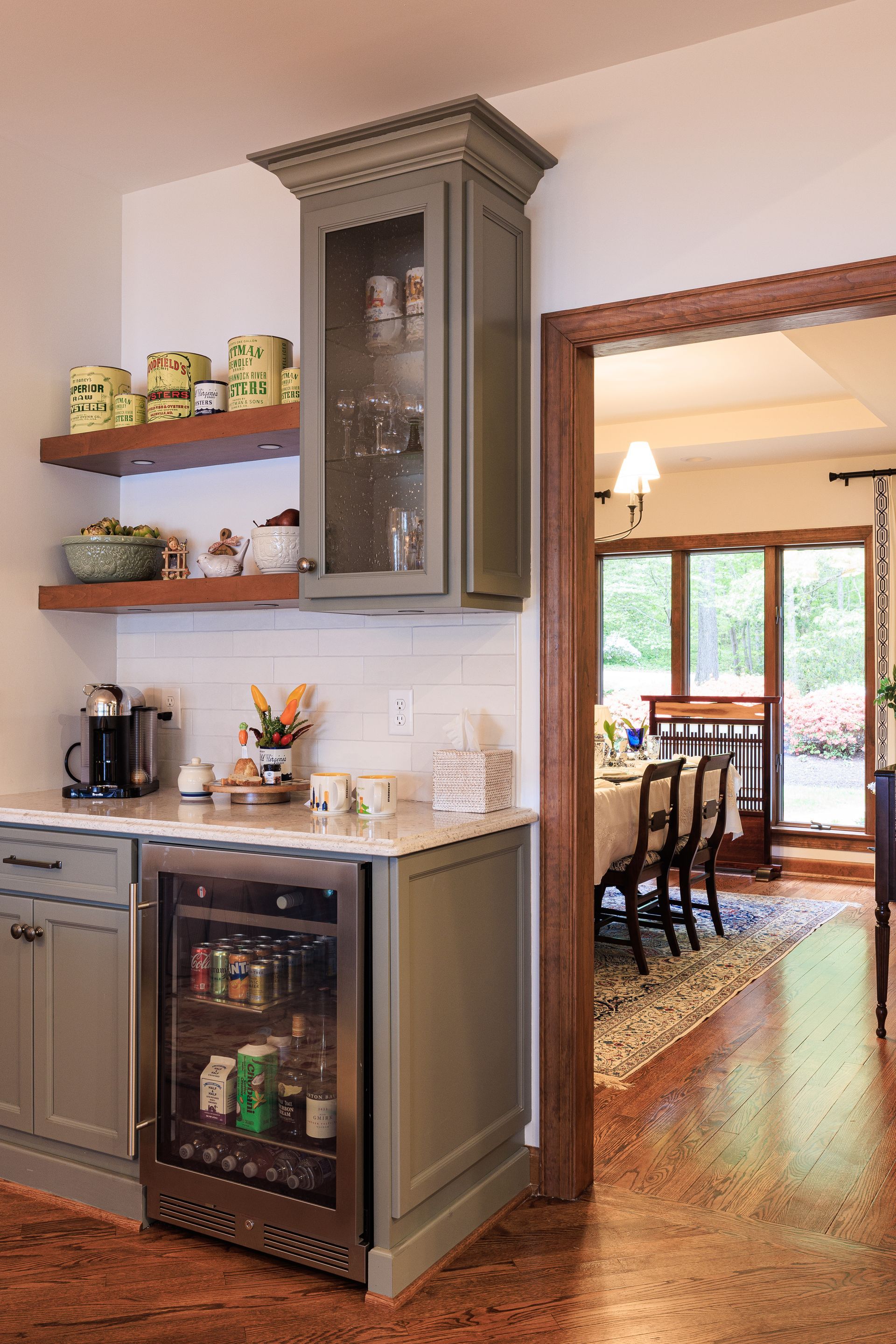 Custom built-in cabinetry with glass display cabinet and warm wood accents