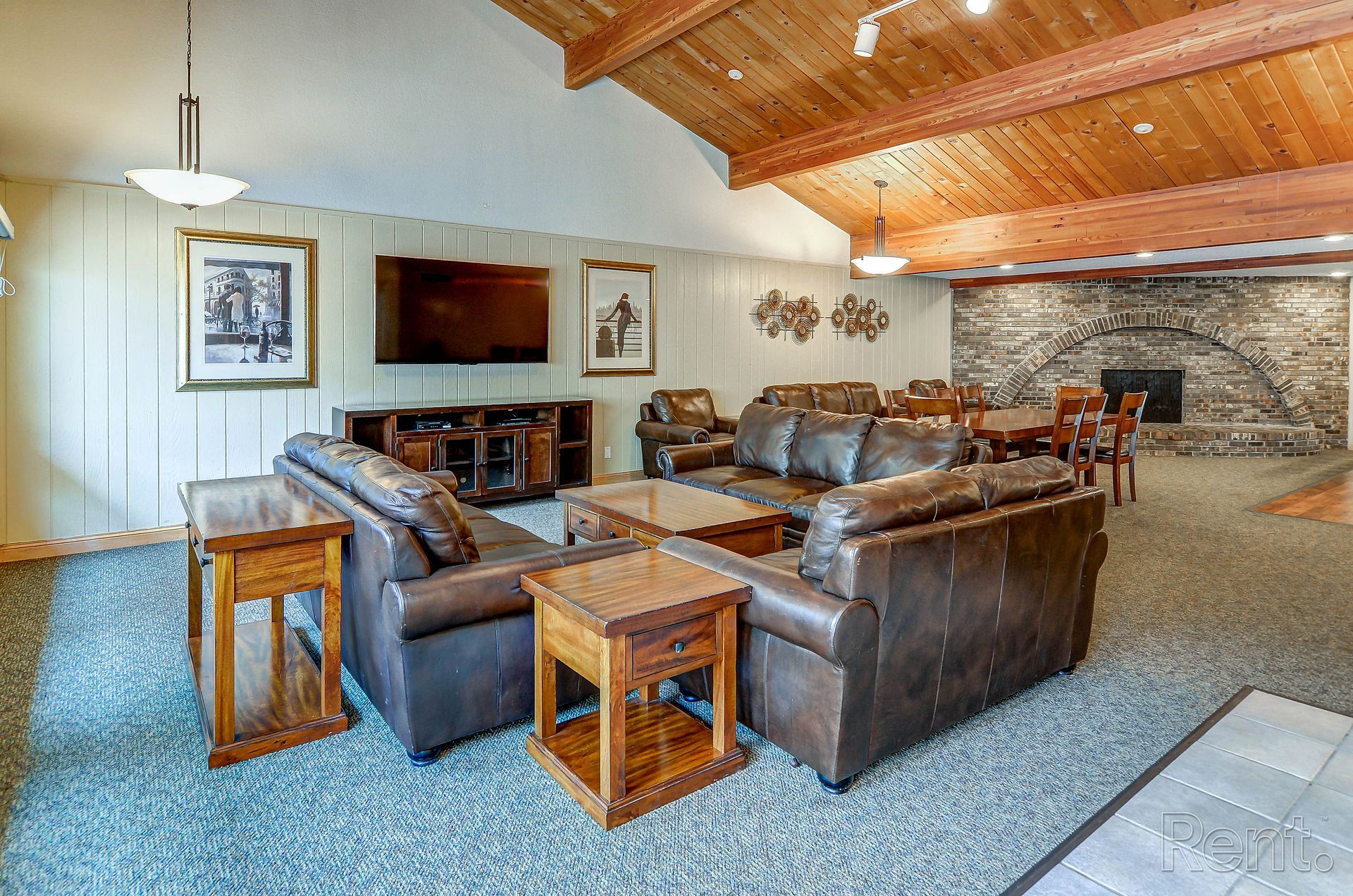 a living room filled with furniture and a flat screen tv .