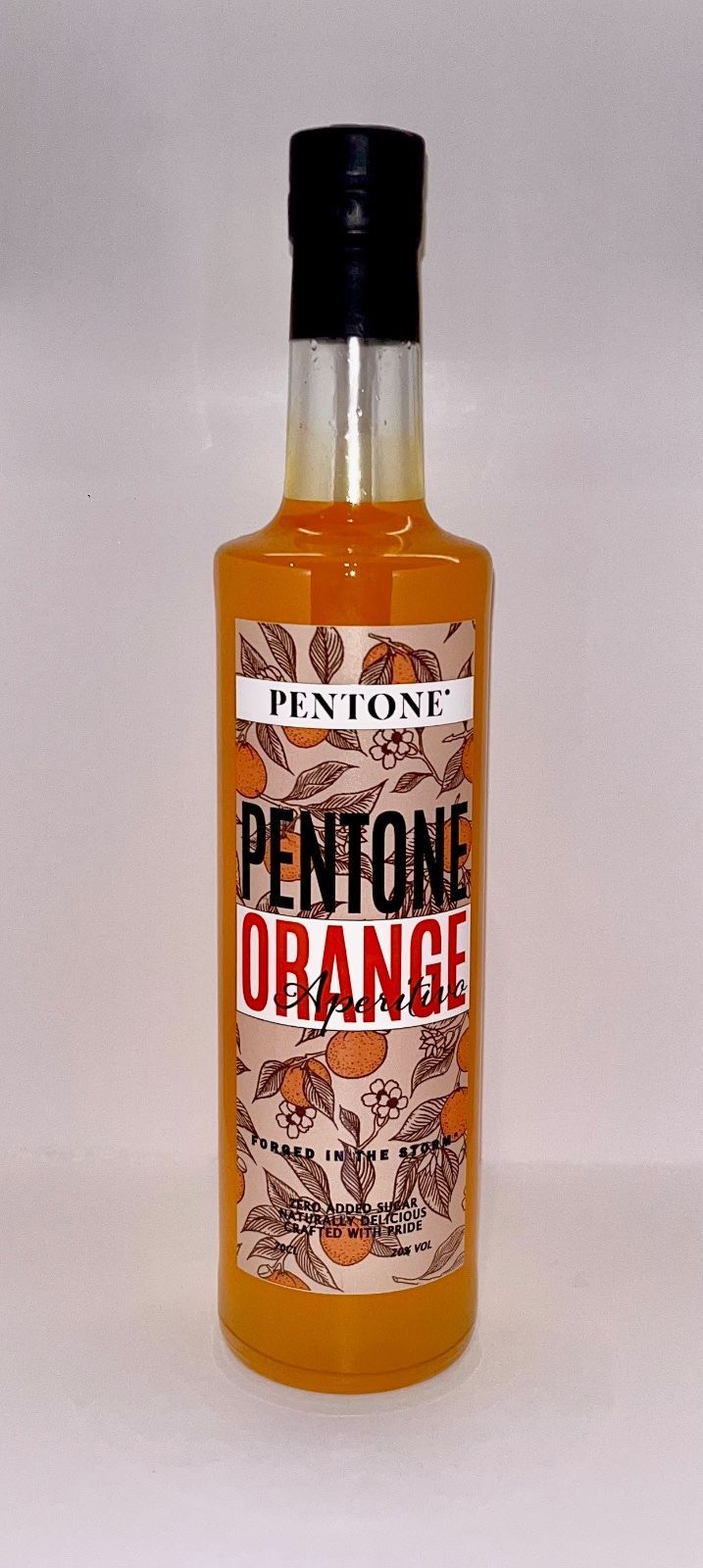 A bottle of pentone orange liqueur is sitting on a white surface.