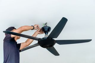 Electrician installing a ceiling fan, Sonoma, CA