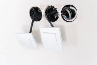 Electrician repairing a light switch and fixture, Sonoma, CA