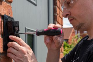 Electrician installing a video doorbell and camera, Sonoma, CA