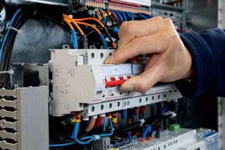 Electrician installing a circuit breaker, Sonoma, CA