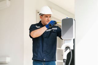 Electrician installing an EV charger, Sonoma, CA