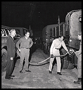 A group of four men fueling the truck - Aliquippa, PA - Woodlawn Oil Co. A group of four men fueling the truck - Aliquippa, PA - Woodlawn Oil Co.