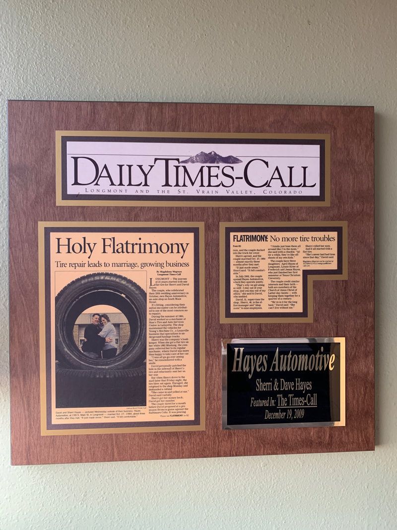 The Times-Call Newspaper Articles hung up on wall showing our history with Sherri and Dave Hayes | Hayes Automotive