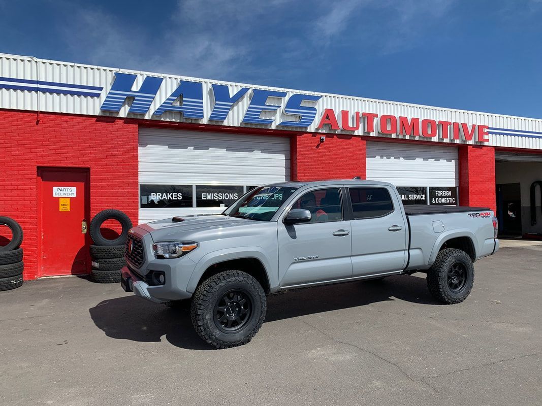 Gray truck parked outside of our garage bays in Longmont, CO | Hayes Automotive