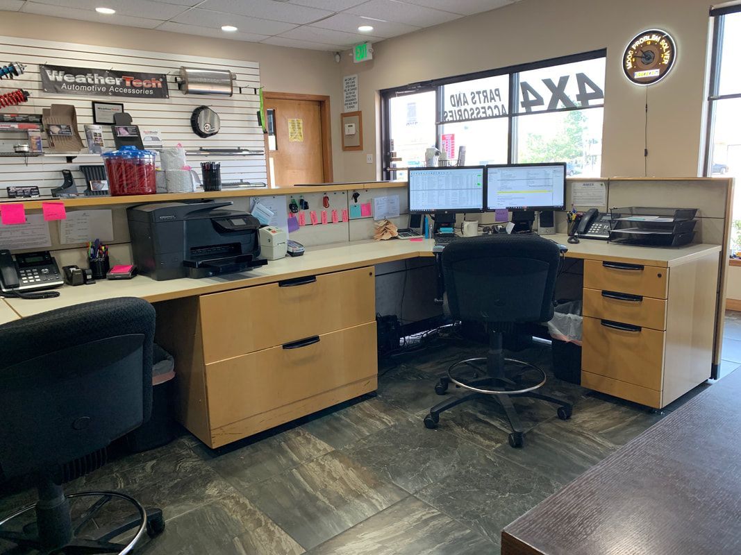 At our desk inside of our shop in Longmont, CO