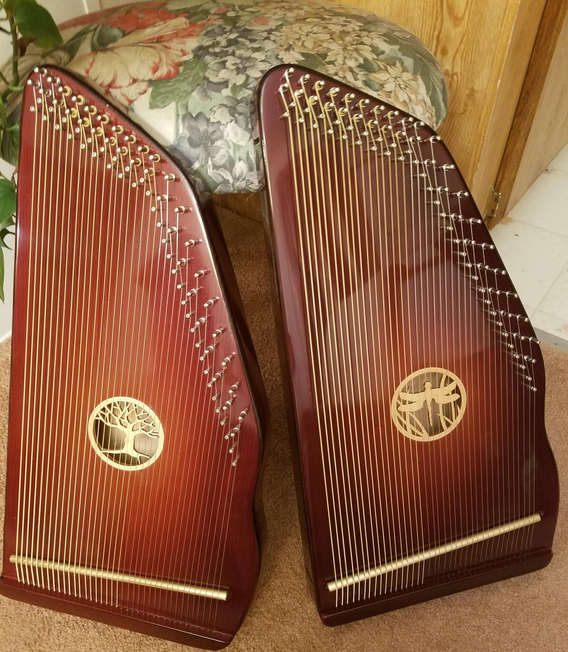 A pair of harps are sitting next to each other