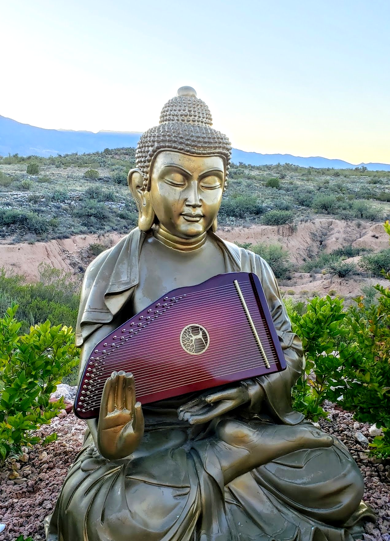 A therapy harp in the arms of the Buddha