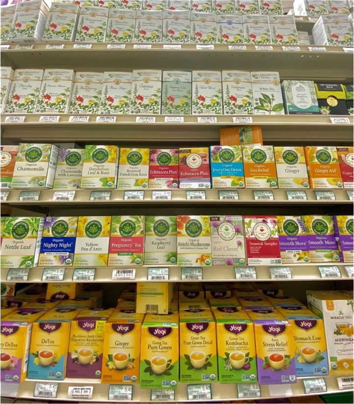 A Grocery Store Shelf Filled With Boxes of Tea