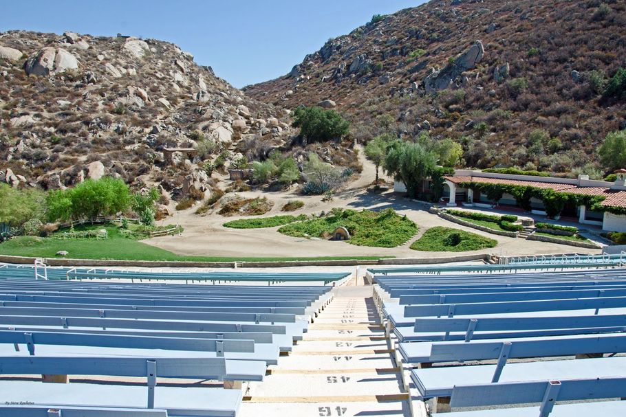 Photo of the Ramona Bowl Amphitheatre from the top of the stands looking down onto the natural stage and Hacienda from set of