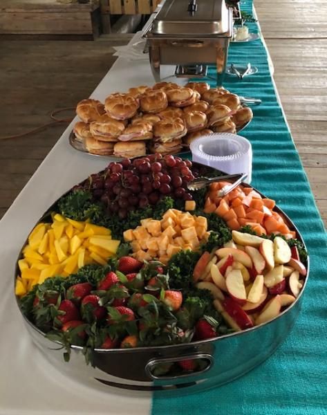 fruit tray with croissant sandwiches