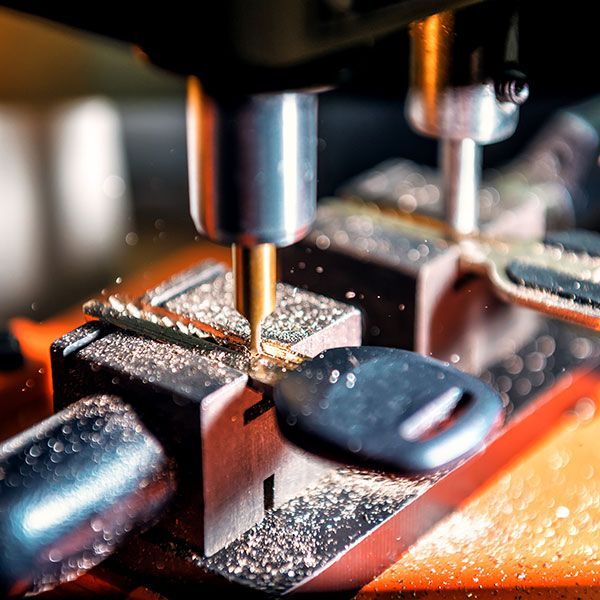 close up of machine shaping keys