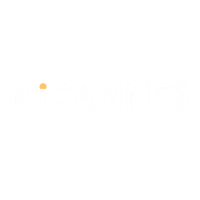 Logo in White with an orange ciricle on the 'i' of the company MiCannes