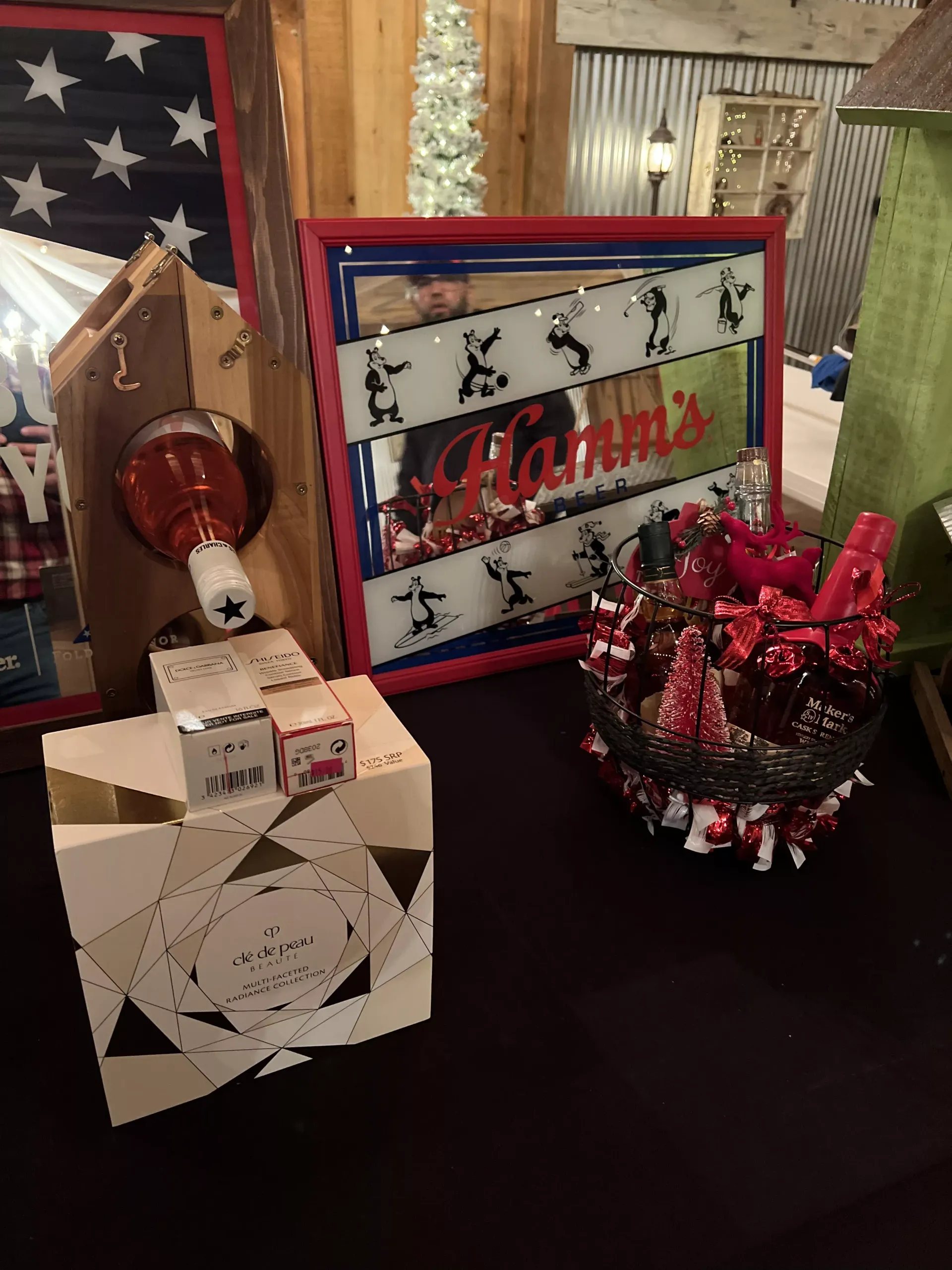 Decorated holiday tabletop display with red, white, and blue patriotic accents and a “Merry” sign
