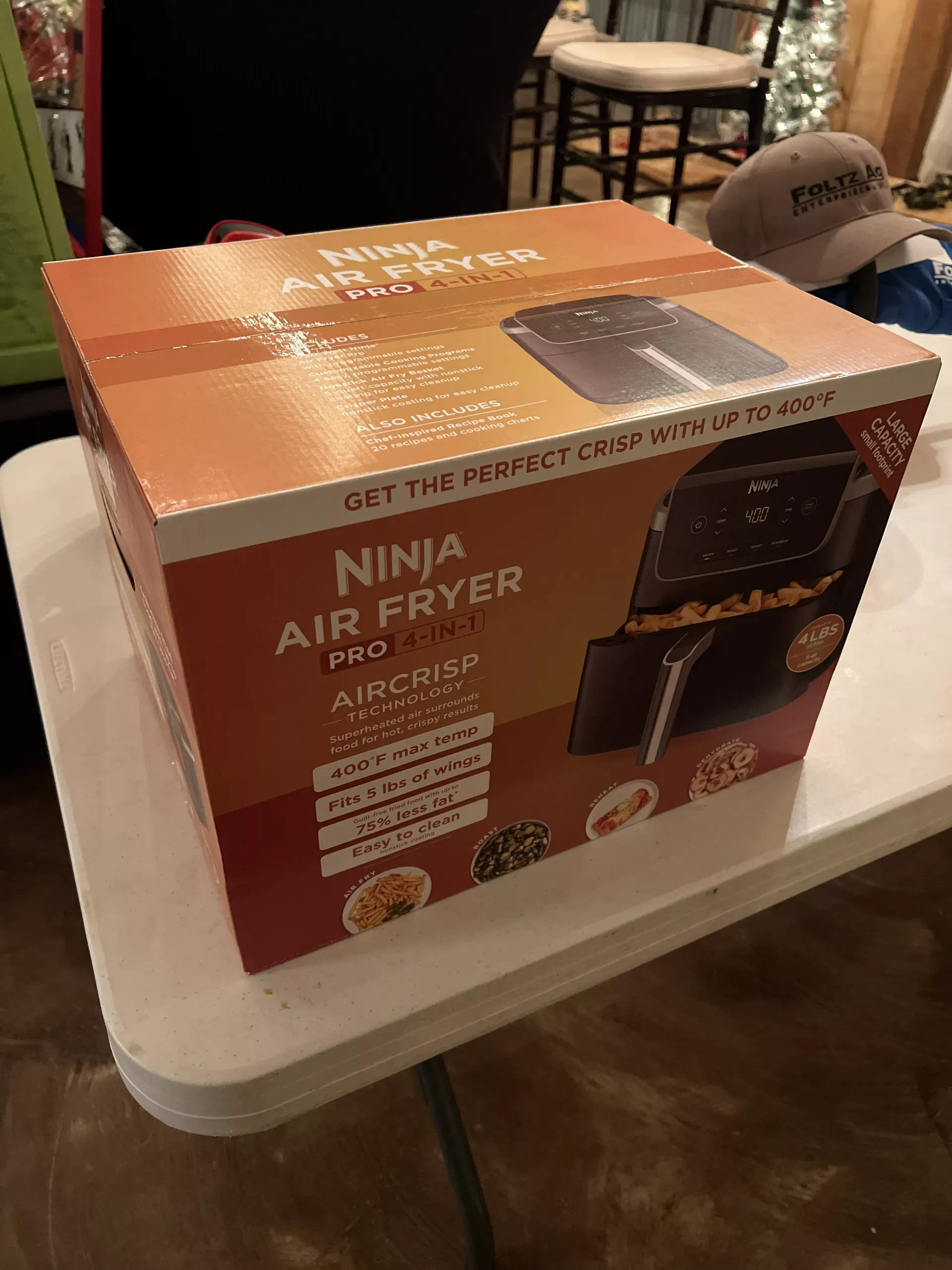 Orange Ninja Air Fryer box on a white table in a home room