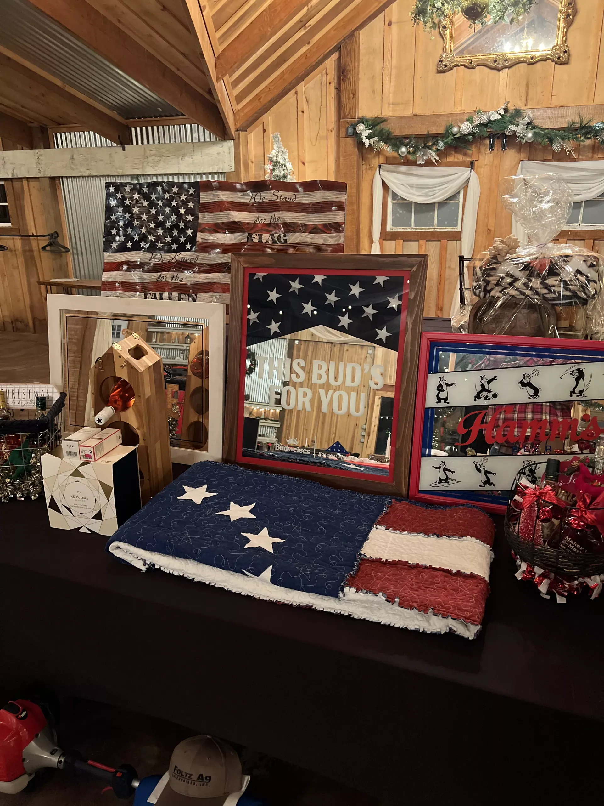 Patriotic 4th of July mantel display with flags, stars, and red, white, and blue decor.