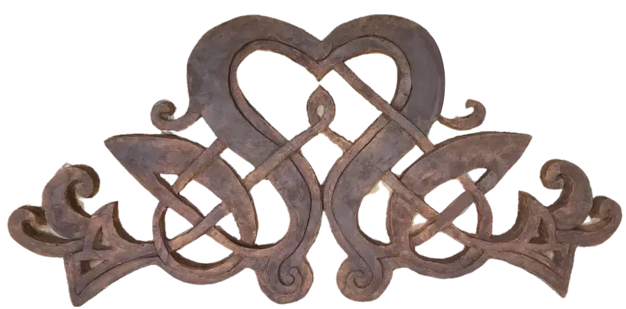 Wooden Celtic knot design. Two connected hearts interweave with knotwork at the base.