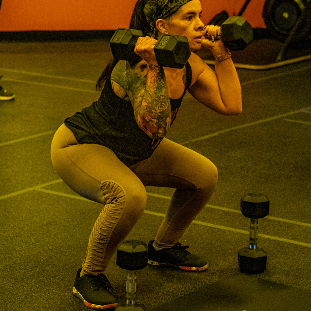 Brickz Fitness member squatting Brickz Fitness member squatting