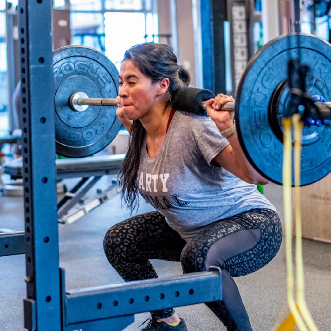 Brickz Fitness member squatting Brickz Fitness member squatting