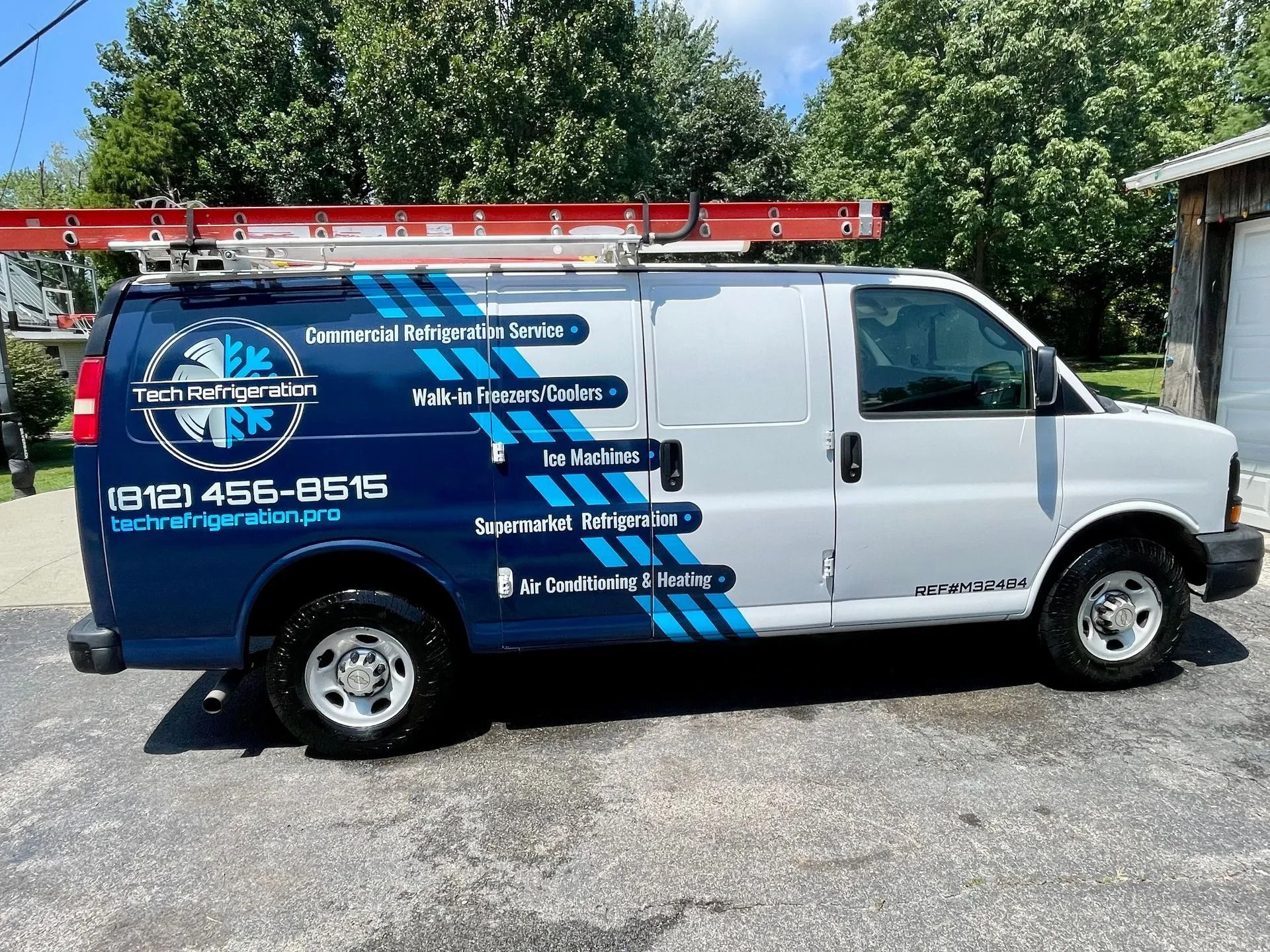 White van with blue and white logo for