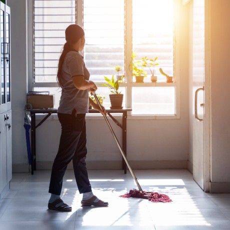 Janitor cleaning in a school
