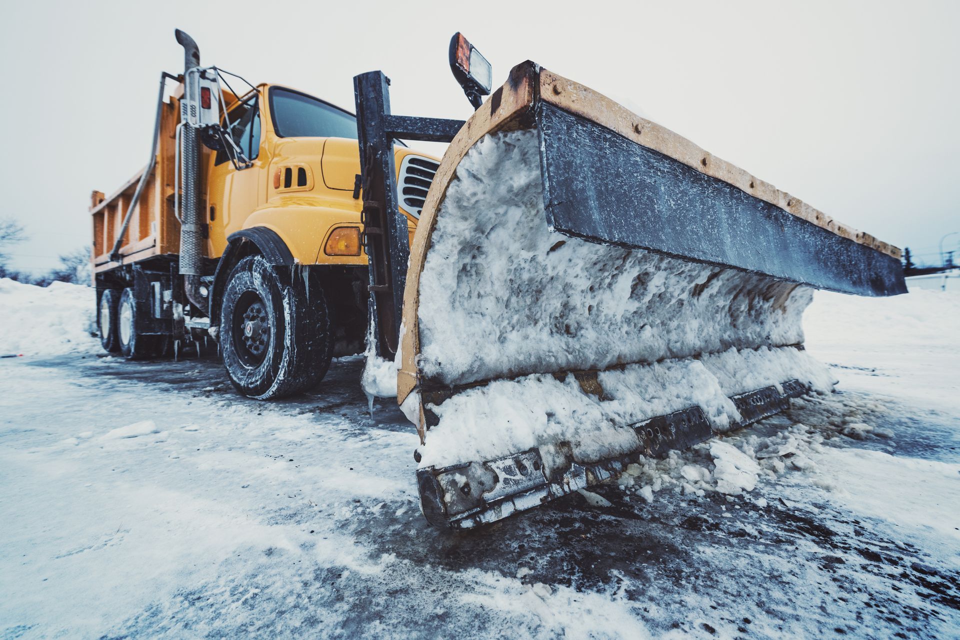 Snow Next To Dump Truck - Worcester, MA - Patriot Seal Coating & Paving