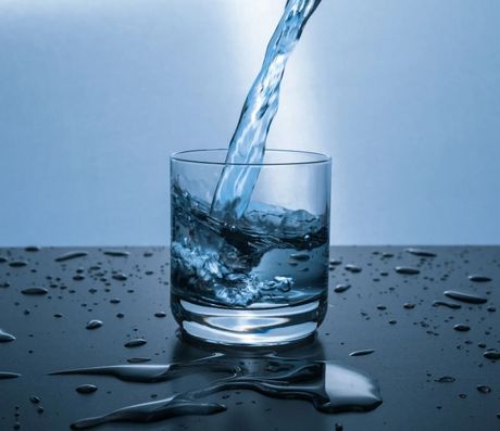 Clean Water Pouring Into a Glass Cup After Water Filtration in Marianna, FL