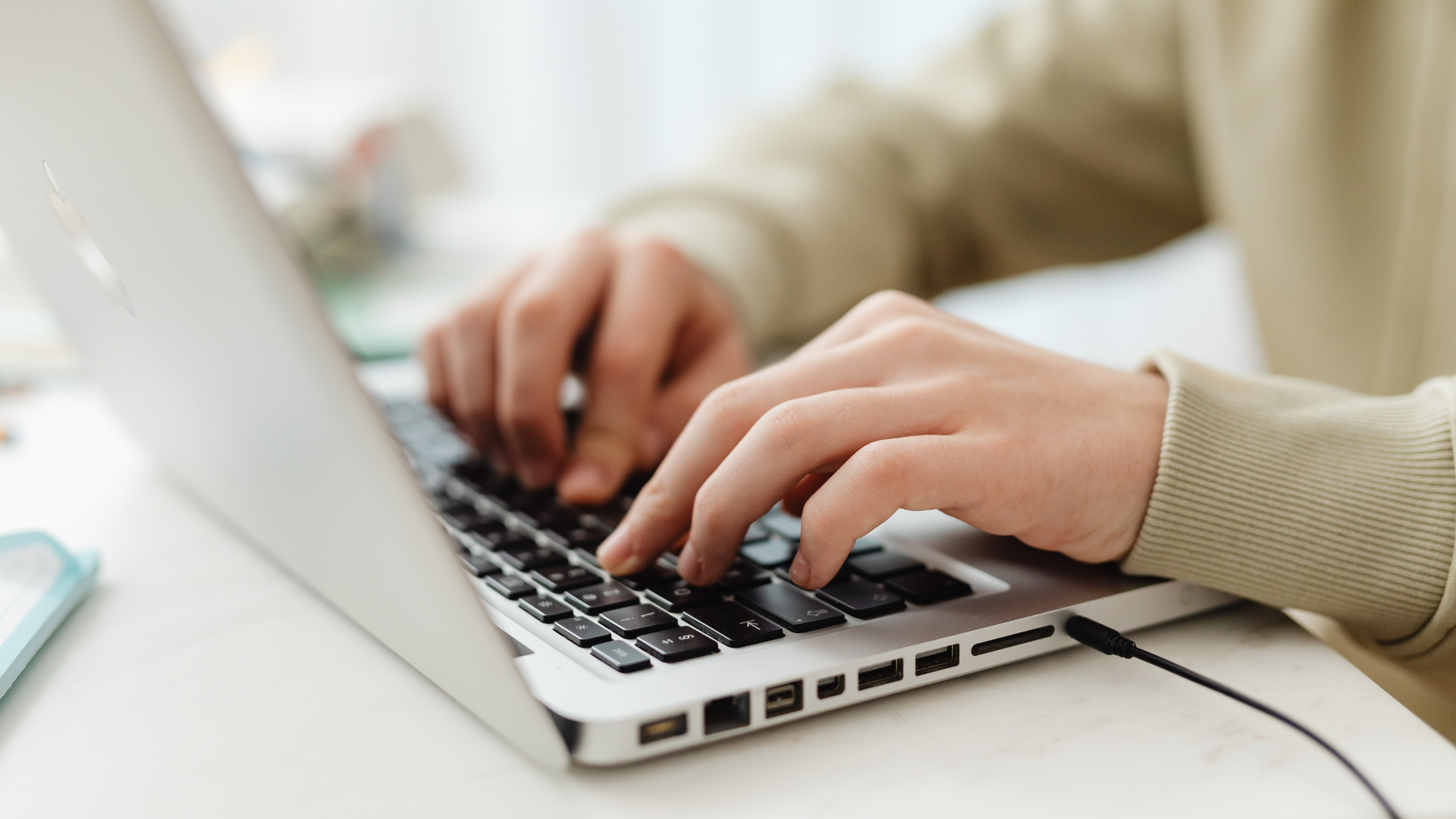 a person typing on a laptop