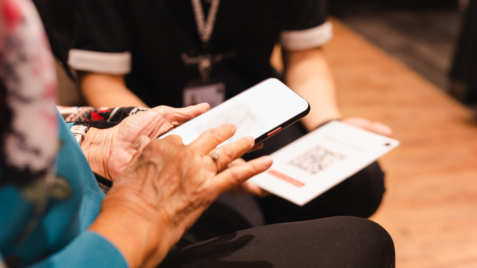 a person scanning a QR code with their mobile device