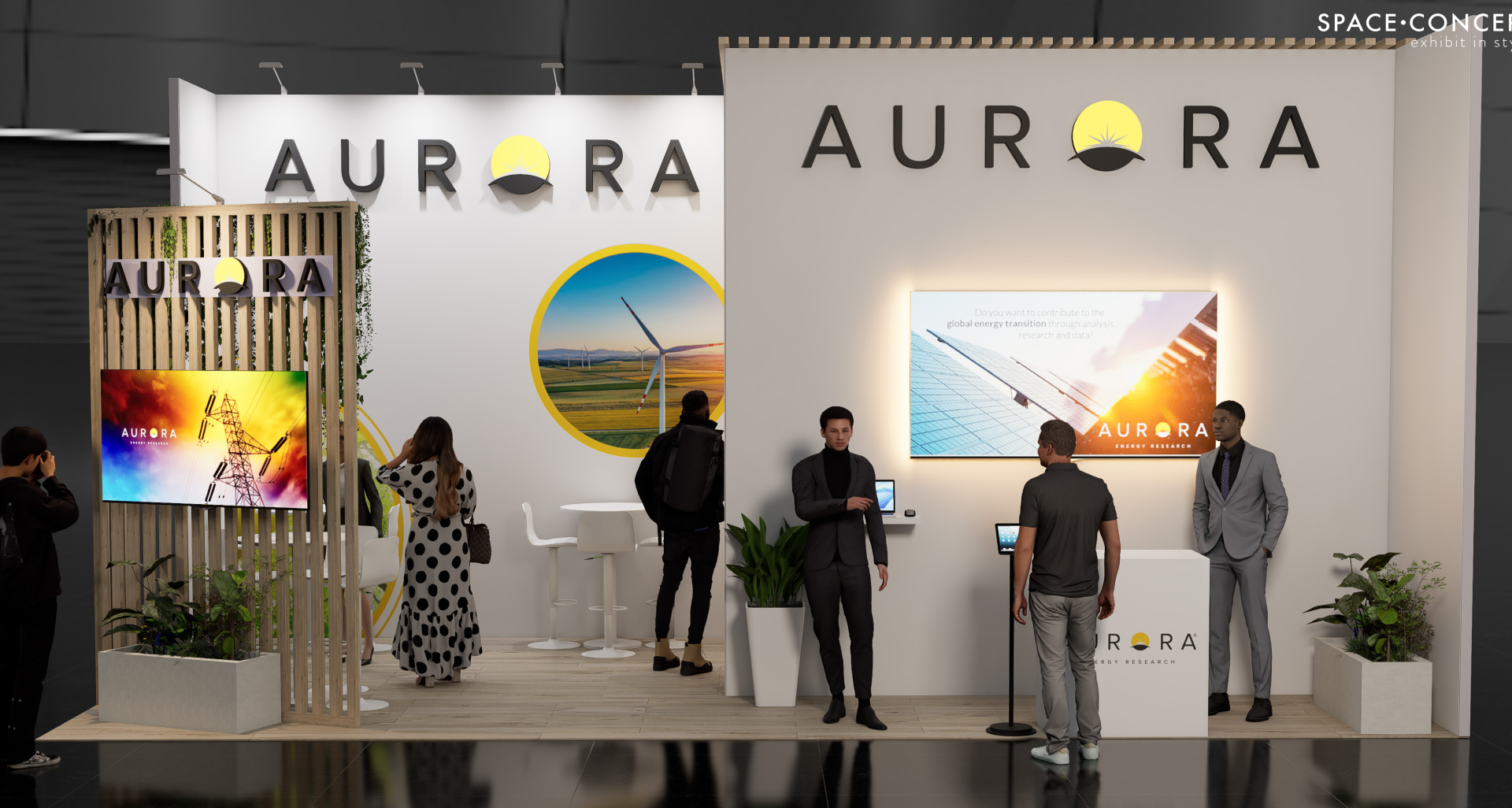 Aurora trade show booth with people, display screens, and logo on white wall.