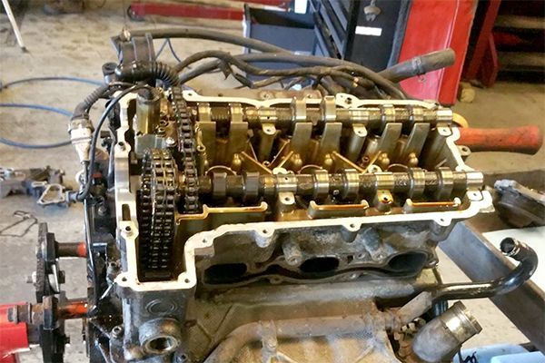 A car engine is being worked on in a garage