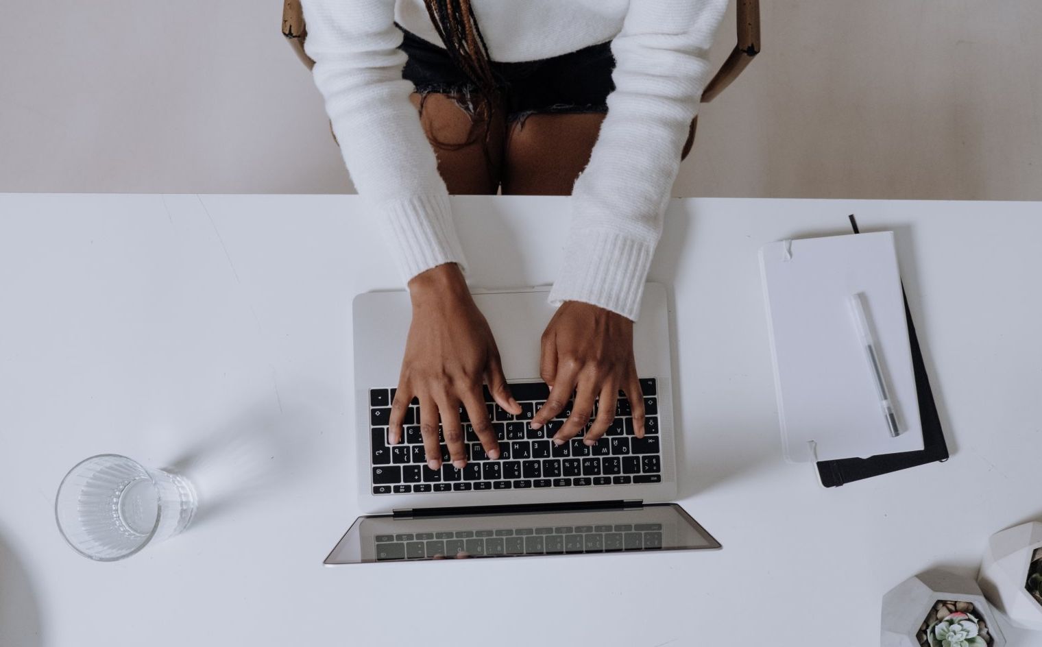 Virtual Assistant working on a laptop with their client.