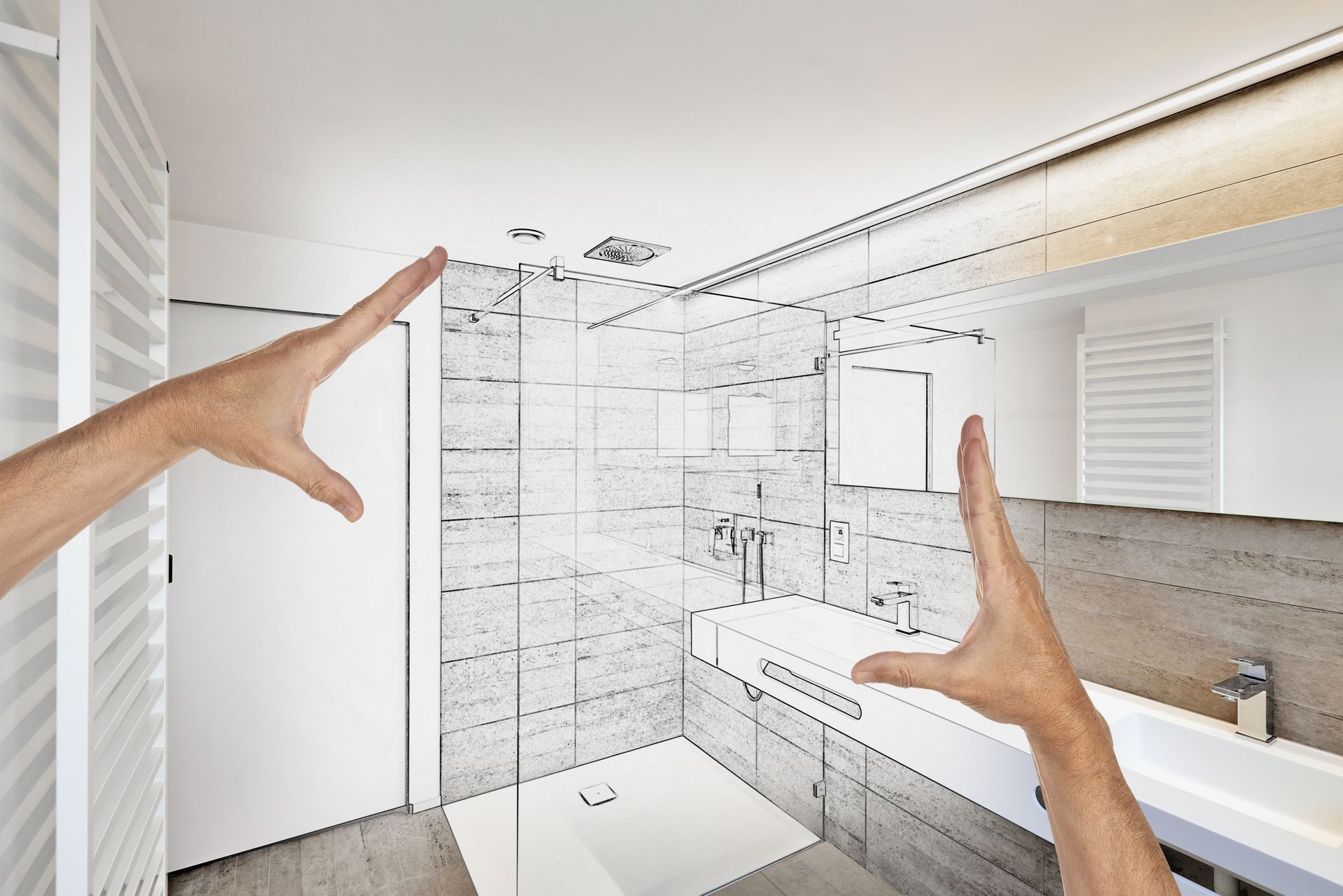 Hands framing a partially sketched bathroom design; shower, sink, and mirror visible.