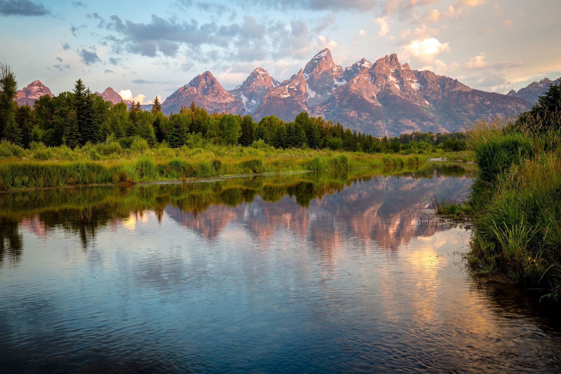 The Snake River winding through Jackson Hole with the Teton mountains in summer