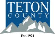 Teton County logo with blue background, white text, gray mountains, and “Est. 1921” below