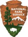 National Park Service logo with mountains, trees, and a bison on an orange shield