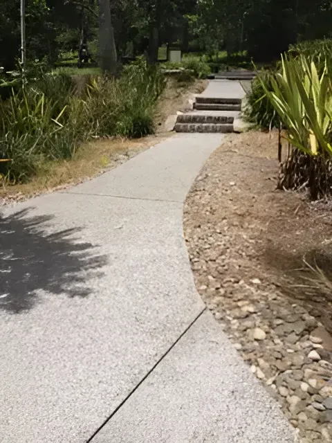 A Concrete Walkway With Stairs On The Side Of It — S & K Gallaway Concreting In West Mackay, QLD