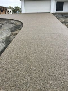 A Red Brick Walkway Leading To A Building In A Field — S & K Gallaway Concreting In West Mackay, QLD