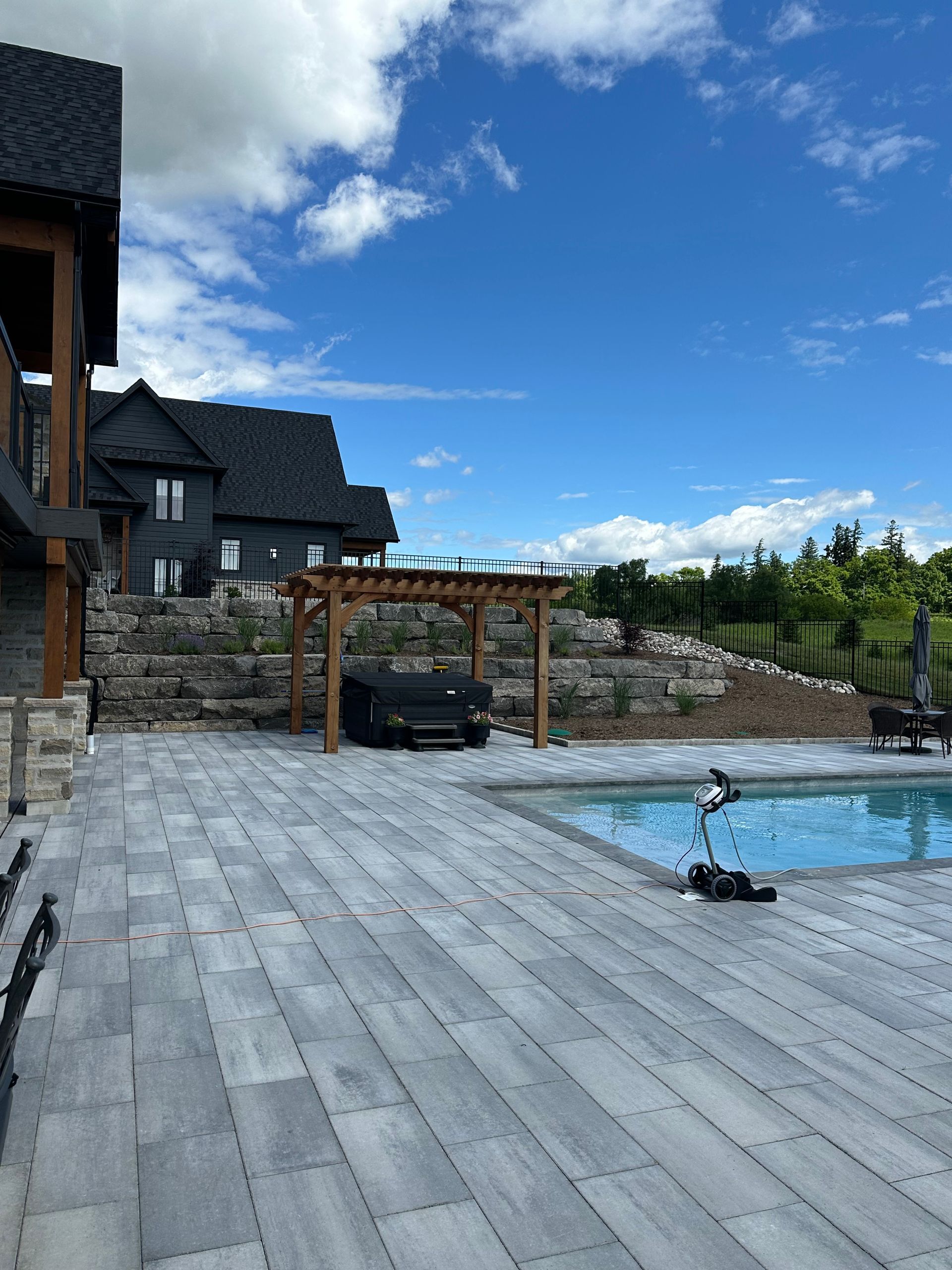 A large house with a swimming pool in front of it