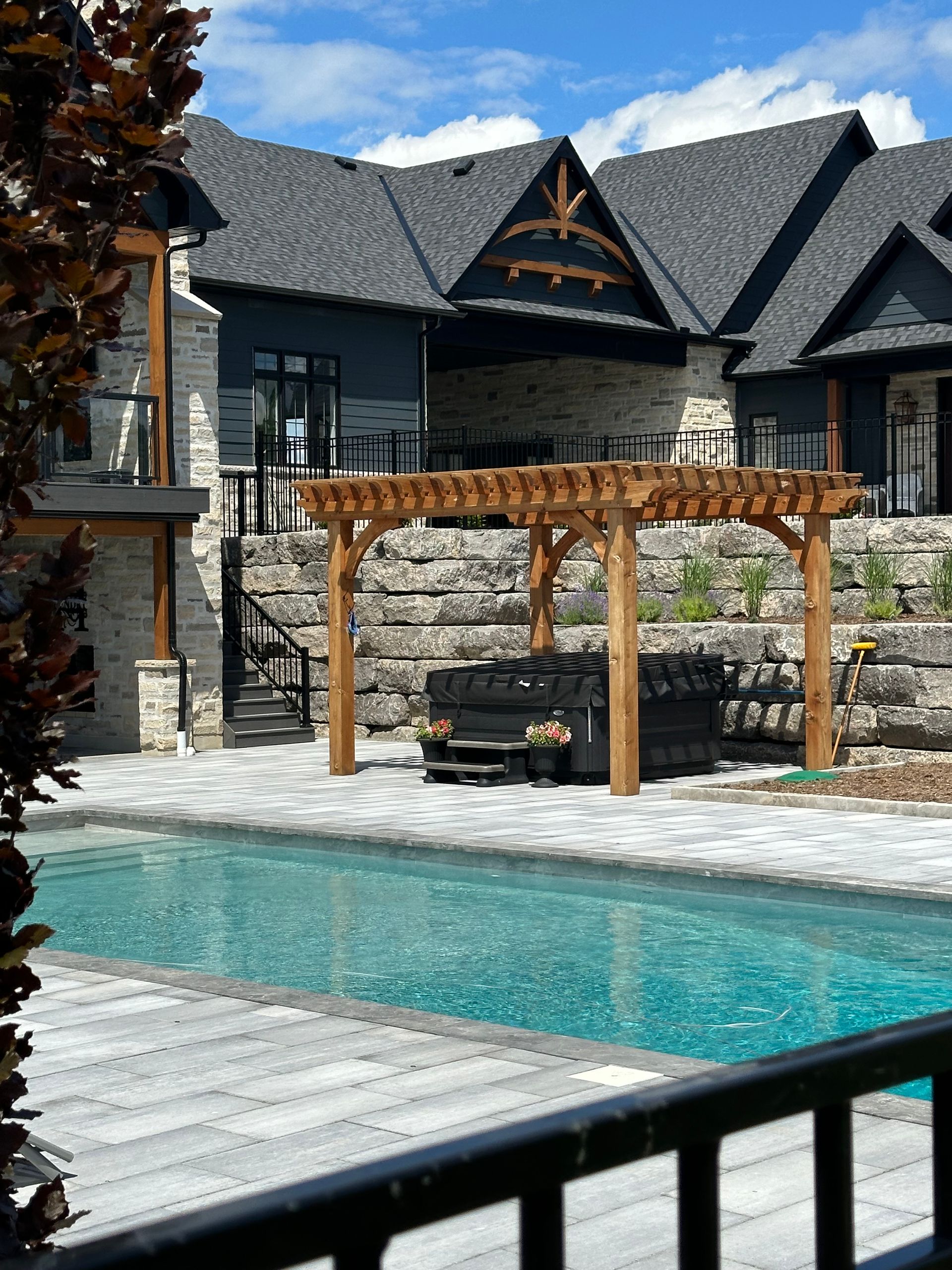 A large house with a swimming pool in front of it