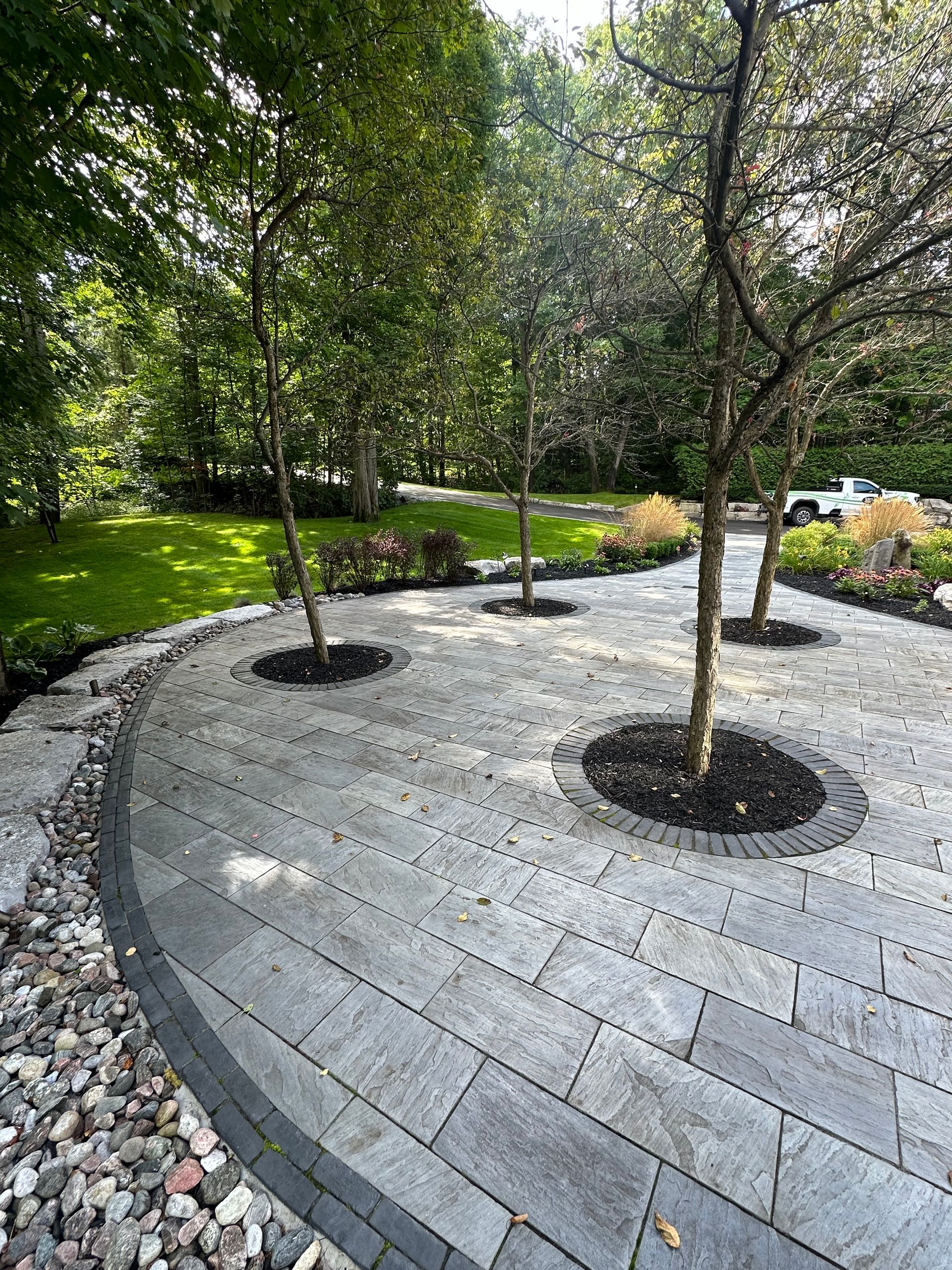 A patio with trees in the middle of it
