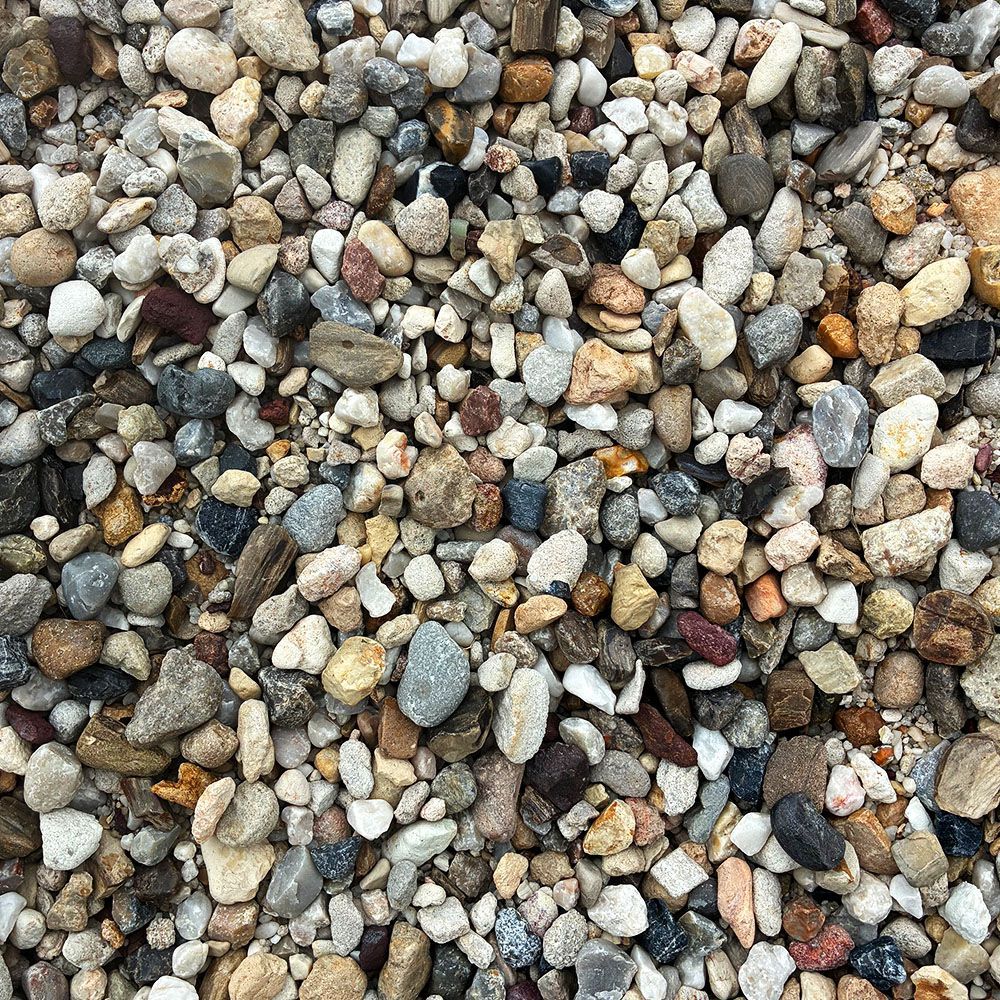 Close-up of multicolored pebbles and gravel filling the frame