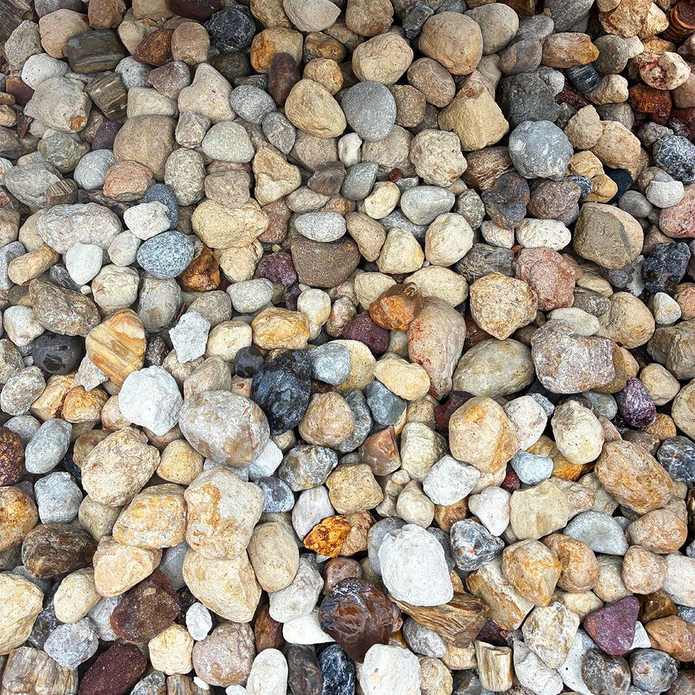 Close-up of assorted smooth pebbles in gray, tan, brown, and white tones