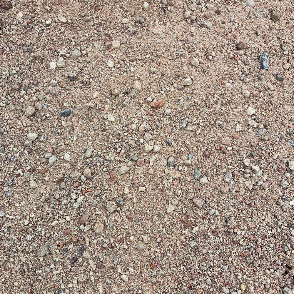 Close-up of light brown gravel and small stones on the ground