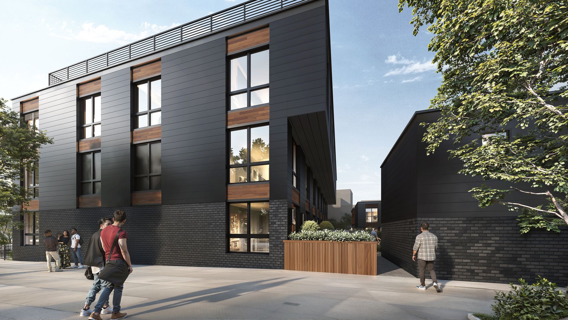 Modern, dark building with rectangular windows and wooden accents, people walking nearby.